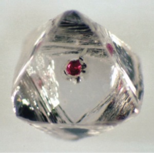 Red garnet inclusion in a diamond